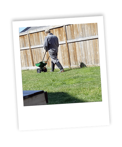 calgary weed control_04 applying fertilization treatment to calgary lawn