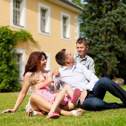 lawn fertilization and weed control image_10 family enjoys green fertilized grass with weed control treatment